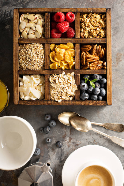 Breakfast foods in a wooden box overhead shot - Foto, afbeelding