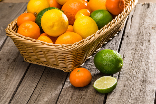 Citrus fruits in basket  - Фото, изображение