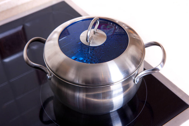 Modern dishes, induction cooker. - Photo, Image