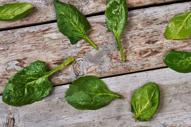 Basil leaves on wooden background. - Foto, Imagen