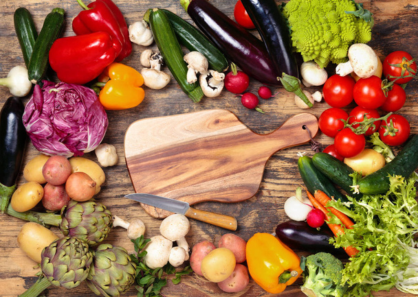 Fresh vegetables on wooden background. - Foto, afbeelding