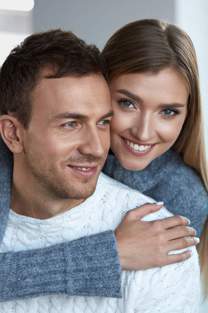 Romantic Couple. Beautiful Woman And Handsome Man In Sweater - Valokuva, kuva