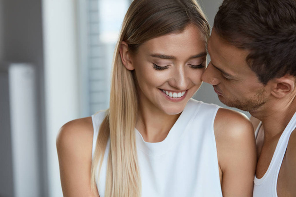 Portrait Of Handsome Man Kissing Happy Woman With Soft Face Skin - Photo, Image