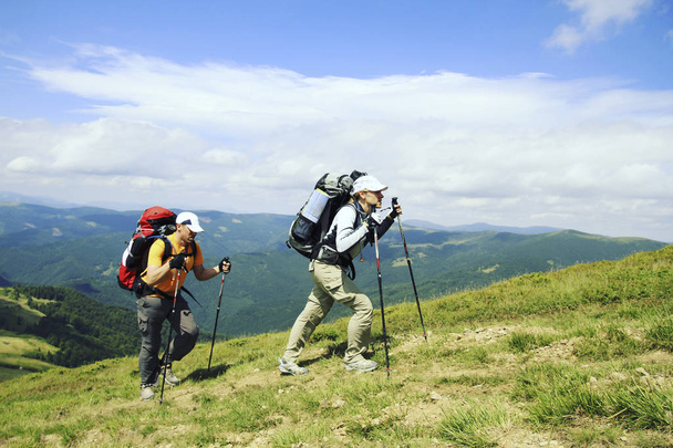Summer hiking.Summer hiking in the mountains with a backpack and tent. - 写真・画像