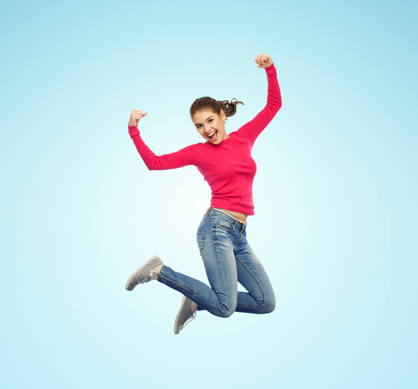 smiling young woman jumping in air - Valokuva, kuva