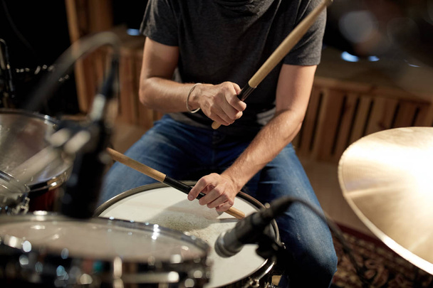 male musician playing drums and cymbals at concert - Photo, image