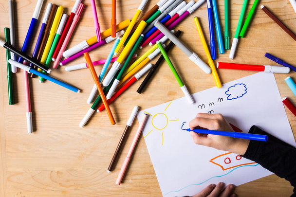 Kid drawing with colored marking pens - Photo, Image
