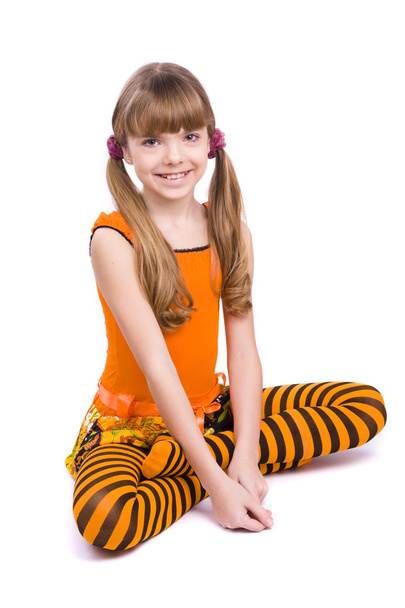 Little girl wearing orange dress - Фото, изображение
