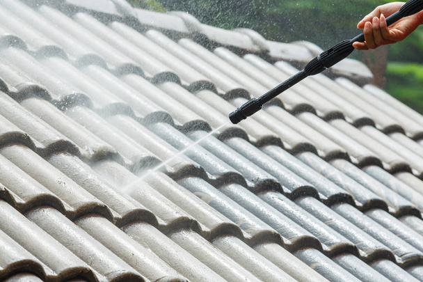 Roof cleaning with high pressure water cleaner - Photo, Image