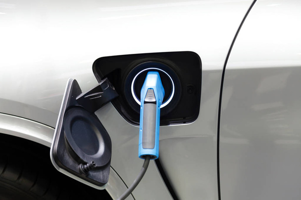 Charging an electric car, Future of transportation - Foto, afbeelding