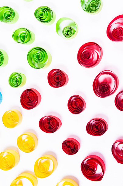 Quilling art. Color paper curls on the white background - Foto, afbeelding