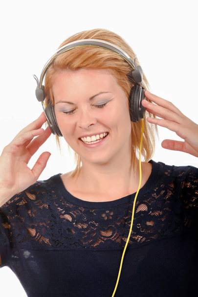 She loves listening to music - Фото, изображение