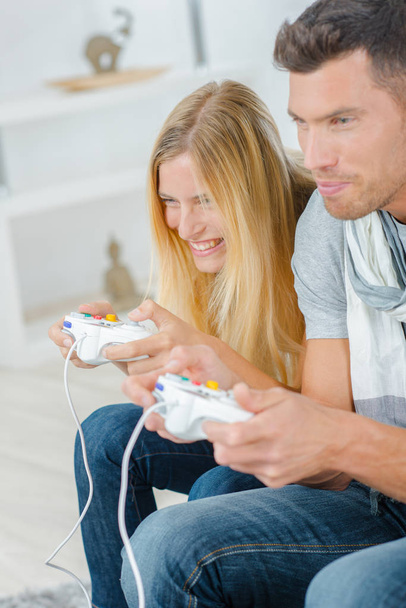 Couple playing computer game - Photo, image
