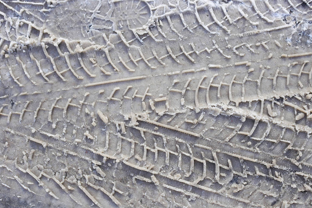 traces of automotive treads on wet snow.  - Photo, Image