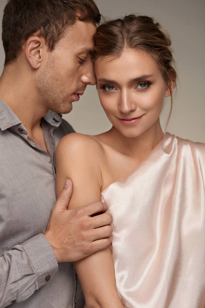 Love Couple. Man Gently Touching Woman With Perfect Makeup - Valokuva, kuva