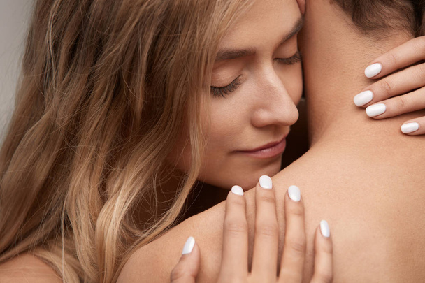 Beautiful Young Woman Smelling Man Smooth Skin. Couple In Love - Fotografie, Obrázek