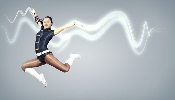 Young woman dancer. With lights effect. - 写真・画像