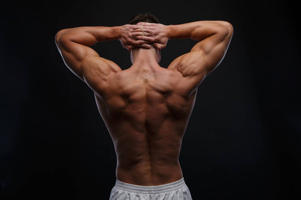 The back view of torso of attractive male body builder - Foto, afbeelding