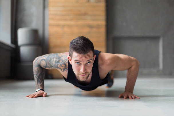 Young man fitness workout, push ups or plank - Photo, Image