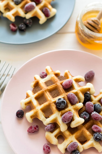 Belgian waffles with honey and frozen berries  - Fotografie, Obrázek