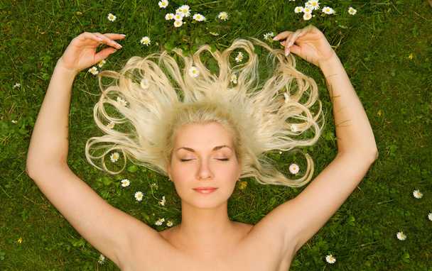 woman relaxing on a meadow - Photo, Image