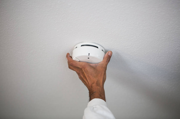 Installation of a smoke detector - Photo, Image
