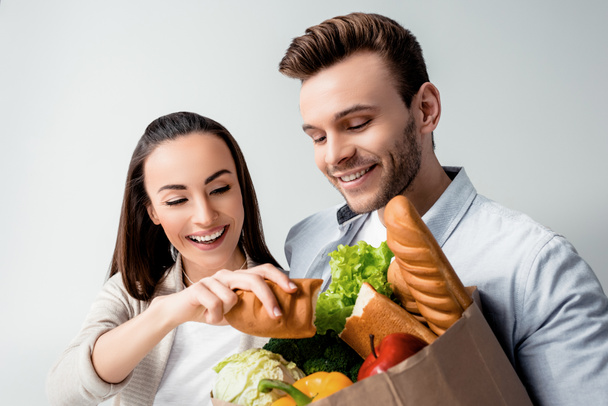 Young couple with grocery bag - Photo, Image