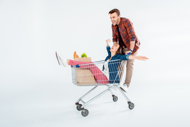 Couple with shopping cart - Фото, зображення