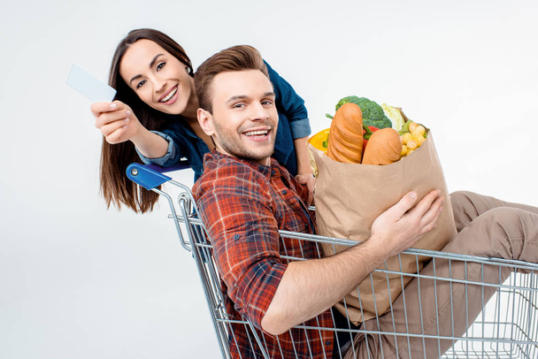 Couple with shopping cart - Φωτογραφία, εικόνα