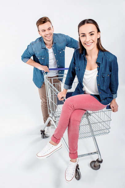 couple with shopping cart - Foto, imagen