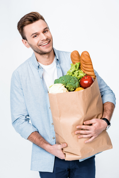 man holding grocery bag - Фото, зображення