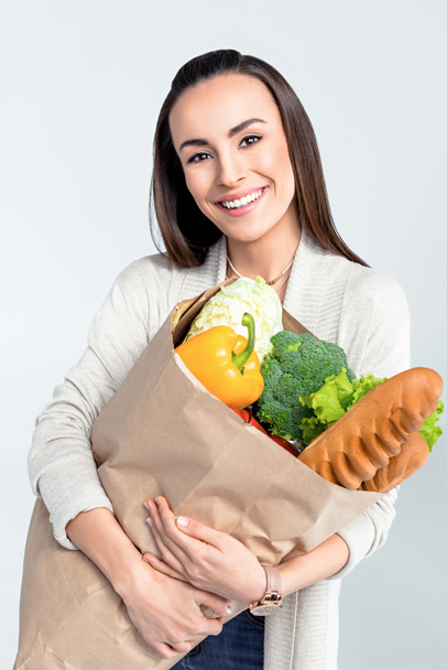 woman holding grocery bag - 写真・画像