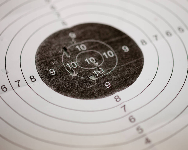 Shooting target with bullet holes - Foto, imagen
