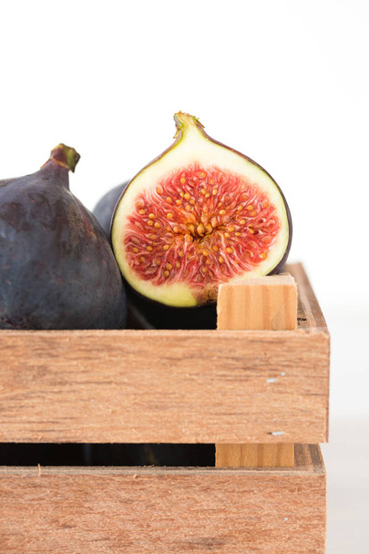Figs in wooden bin - Photo, Image