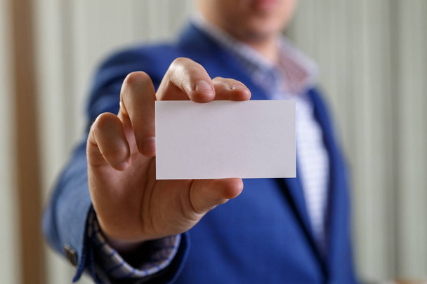 Businessman holding visit or business card. - Foto, imagen