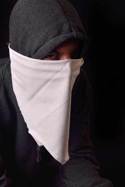 Close up of an unrecognizable young man wearing white balaclava  - Фото, изображение