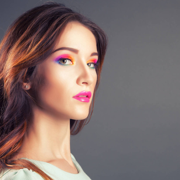 Beautiful young woman with vivid makeup  - Foto, afbeelding