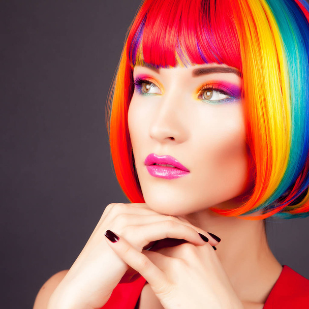 beautiful woman wearing colorful wig - Foto, Bild