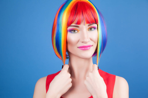 beautiful woman wearing colorful wig - Фото, зображення