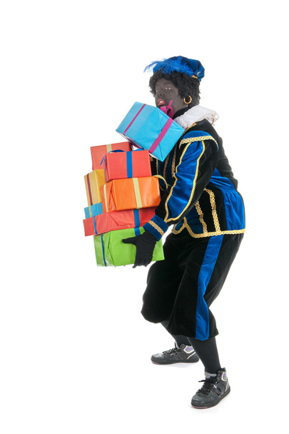 Dutch black pete carrying many presents - Foto, Bild