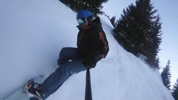 Close up of extreme snowboarder riding by powder at mountain backcountry. FullHD slow motion video by action camera GoPro - Footage, Video