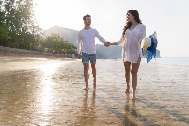 Couple On Beach Summer Vacation, Beautiful Young Happy People In Love Walking, Man Woman Smile Holding Hands - Photo, image
