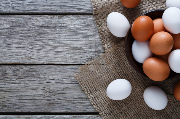 Fresh chicken brown eggs on sack, organic farming background - Fotografie, Obrázek