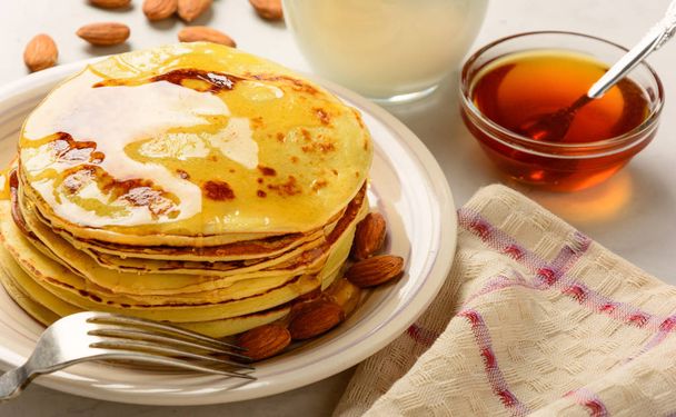Pancakes with honey and almond  - Photo, Image