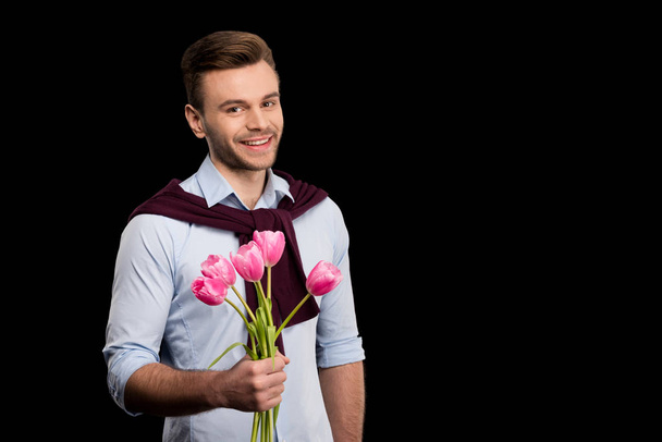 Man holding tulips - Fotoğraf, Görsel
