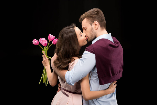 couple in love with tulips - Фото, изображение