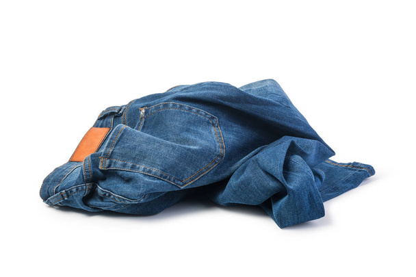 Mavi jeans beyaz arka plan üzerinde katlanmış - Fotoğraf, Görsel