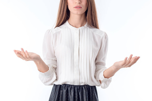 girl in shirt raises hands on parties is isolated  a white background - Photo, image
