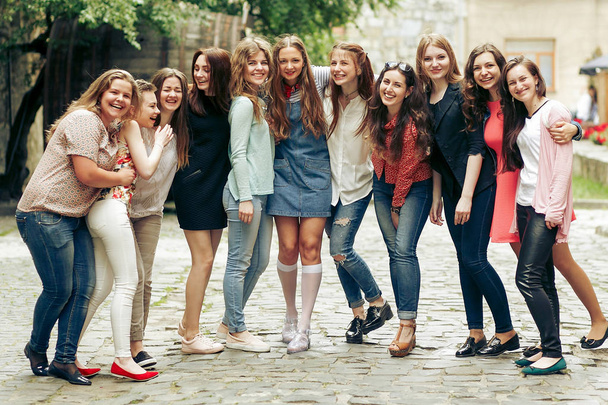 smiling girls posing on city street - Photo, Image