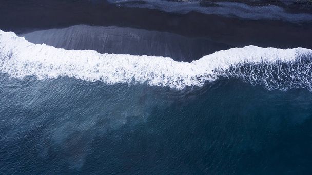 volcanic black sand beach and beautiful waves - Fotó, kép
